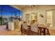 Outdoor kitchen and dining area with stainless steel grill and outdoor furniture at 7340 Barclay Ct, University Park, FL 34201