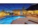Backyard screened pool featuring a brick patio, spa, and comfortable lounge chairs for ultimate relaxation and entertaining at 7340 Barclay Ct, University Park, FL 34201