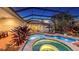 Backyard screened pool and patio with outdoor furniture for relaxation and entertaining under a covered lanai at 7340 Barclay Ct, University Park, FL 34201