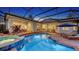 Inviting screened-in pool area with spa and outdoor dining, perfect for entertaining guests at 7340 Barclay Ct, University Park, FL 34201