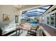 Screened lanai with comfortable seating around a pool and spa at 7340 Barclay Ct, University Park, FL 34201