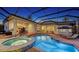 Backyard screened pool and patio with outdoor furniture for relaxation and entertaining under a covered lanai at 7340 Barclay Ct, University Park, FL 34201