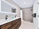 Modern bathroom featuring double vanity, sleek fixtures, and step-in shower at 749 Tropical Cir, Sarasota, FL 34242