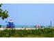Beach view featuring beachgoers, sailboats, and a lifeguard station at 749 Tropical Cir, Sarasota, FL 34242