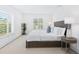 Bright bedroom with plantation shutters, large windows, and stylish decor at 749 Tropical Cir, Sarasota, FL 34242