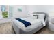 Charming bedroom with lots of natural light from plantation shutters, and neutral paint at 749 Tropical Cir, Sarasota, FL 34242
