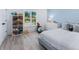 ' bedroom with light blue accent wall, built-in shelving, and charming decor at 749 Tropical Cir, Sarasota, FL 34242