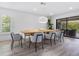 Modern dining room with a wooden table and comfortable chairs at 749 Tropical Cir, Sarasota, FL 34242