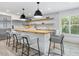 Eat-in kitchen features a butcher block island, stainless steel appliances, and subway tile backsplash at 749 Tropical Cir, Sarasota, FL 34242