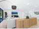 Bright and airy living room featuring a large white sectional and modern decor at 749 Tropical Cir, Sarasota, FL 34242