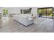 Spacious living room features a large sectional sofa and sliding glass doors at 749 Tropical Cir, Sarasota, FL 34242