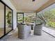 Covered outdoor seating area with views of nature at 749 Tropical Cir, Sarasota, FL 34242
