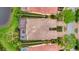 Overhead view of a single-story home and pool, surrounded by mature trees at 7655 Pesaro Dr, Sarasota, FL 34238