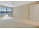 Bright bedroom with carpet flooring, ceiling fan, and a window allowing for natural light at 7655 Pesaro Dr, Sarasota, FL 34238