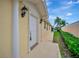 Home's entrance featuring columns and a beautifully manicured yard at 7655 Pesaro Dr, Sarasota, FL 34238