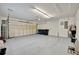 Spacious garage with a roll-up door and ample storage space at 7655 Pesaro Dr, Sarasota, FL 34238