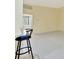 Inviting living space with tile flooring, flowing into the kitchen and leading to the bathroom at 7655 Pesaro Dr, Sarasota, FL 34238