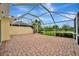Spacious brick paver patio with screened enclosure, perfect for outdoor activities and relaxation at 7655 Pesaro Dr, Sarasota, FL 34238