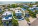 Aerial view showcases the home's close proximity to the beach and ocean views at 785 Jacaranda Rd, Anna Maria, FL 34216