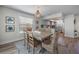 Open concept dining room with views into the kitchen, beachy decor, and lots of natural light at 785 Jacaranda Rd, Anna Maria, FL 34216