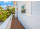 Beautiful exterior shot with tropical foliage at 785 Jacaranda Rd, Anna Maria, FL 34216
