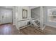 Inviting foyer with console table, mirror, and staircase at 785 Jacaranda Rd, Anna Maria, FL 34216