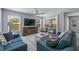Bright living room features beachy decor, light walls, comfortable seating, and an open layout at 785 Jacaranda Rd, Anna Maria, FL 34216