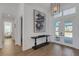 Elegant foyer with high ceilings, stylish light fixture, and modern decor at 8207 Nevis Run, Bradenton, FL 34202