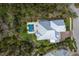 Expansive property featuring a metal roof, a private pool, and a lush, well-maintained lawn at 8227 37Th Avenue W Cir, Bradenton, FL 34209