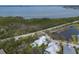 Stunning waterfront property with a private pool, lush landscaping, and serene bay views at 8227 37Th Avenue W Cir, Bradenton, FL 34209
