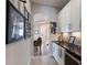 Hallway leading to the dining room featuring art decorations on the wall at 8227 37Th Avenue W Cir, Bradenton, FL 34209