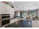 Gourmet kitchen featuring granite countertops, stainless steel appliances, and ample storage space at 8227 37Th Avenue W Cir, Bradenton, FL 34209