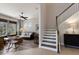 Inviting living room featuring wood floors, lots of natural light, and open staircase to the second floor at 8227 37Th Avenue W Cir, Bradenton, FL 34209