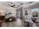 Spacious main bedroom with decorative wood ceiling, hardwood floors and sitting area at 8227 37Th Avenue W Cir, Bradenton, FL 34209