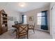 Home office with traditional style furniture and decor, two windows, and neutral carpeting at 8227 37Th Avenue W Cir, Bradenton, FL 34209