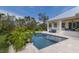 Relaxing pool with jacuzzi, patio area, and lush landscaping creating a private outdoor oasis at 8227 37Th Avenue W Cir, Bradenton, FL 34209