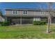 Well-maintained backyard featuring green grass and a screened patio for outdoor enjoyment at 8521 Canyon Creek Trl, Parrish, FL 34219