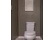 Powder room with a toilet, gray walls, and Gathering themed art at 8521 Canyon Creek Trl, Parrish, FL 34219