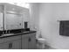 Modern bathroom with double vanity, granite countertops, and a sleek, glass-enclosed shower at 8521 Canyon Creek Trl, Parrish, FL 34219
