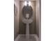 Narrow bathroom featuring a oval mirror, modern lighting fixture and vanity sink at 8521 Canyon Creek Trl, Parrish, FL 34219