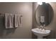 Bathroom with gray walls, a vanity and oval mirror at 8521 Canyon Creek Trl, Parrish, FL 34219