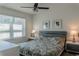 Bright bedroom featuring a ceiling fan and neutral colors, filled with natural light at 8521 Canyon Creek Trl, Parrish, FL 34219
