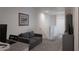 Inviting second floor hallway features a small gray couch, entertainment center and decorative artwork at 8521 Canyon Creek Trl, Parrish, FL 34219