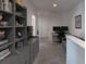 Relaxing upstairs loft with desk and gray couch offers a quiet and productive space at 8521 Canyon Creek Trl, Parrish, FL 34219