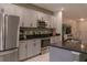 Close up of stainless steel kitchen appliances and black countertops at 8521 Canyon Creek Trl, Parrish, FL 34219