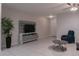 A cozy living room showcases tile flooring and stylish decor for comfortable living at 8521 Canyon Creek Trl, Parrish, FL 34219