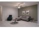 Living room with tile flooring, ceiling fan, and stylish furniture create a comfortable area at 8521 Canyon Creek Trl, Parrish, FL 34219