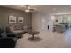 The open-concept living room connects seamlessly to the kitchen, perfect for entertaining at 8521 Canyon Creek Trl, Parrish, FL 34219