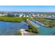 Aerial view of the condo community and boat docks with water views at 9203 Griggs Rd # A302, Englewood, FL 34224