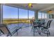 Relaxing screened balcony offers picturesque water views, ideal for outdoor lounging at 9203 Griggs Rd # A302, Englewood, FL 34224